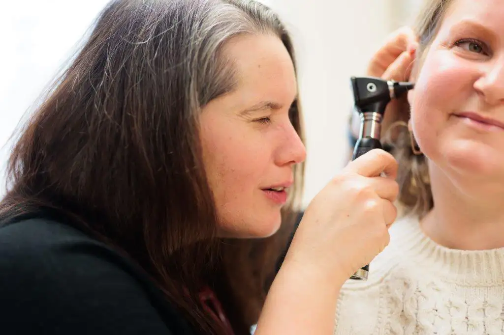 doctor providing ear exam
